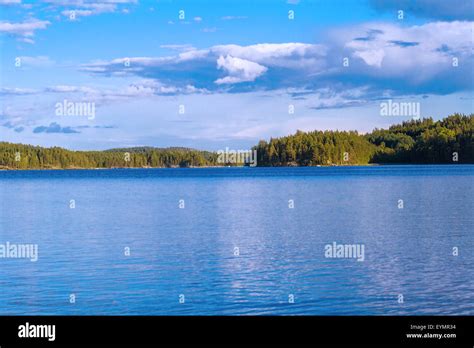 Lake Summer View With Reflection Of Clouds On Water Surface Finland