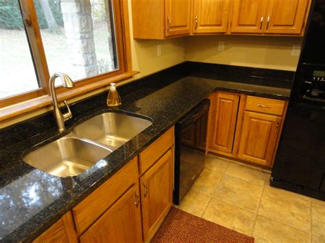 It pairs extremely well with honey oak cabinets, and goes great with black or white cabinets as well! Uba Tuba Kitchen Countertops - Traditional - Kitchen - Cedar Rapids - by PrimoTops, LLC.