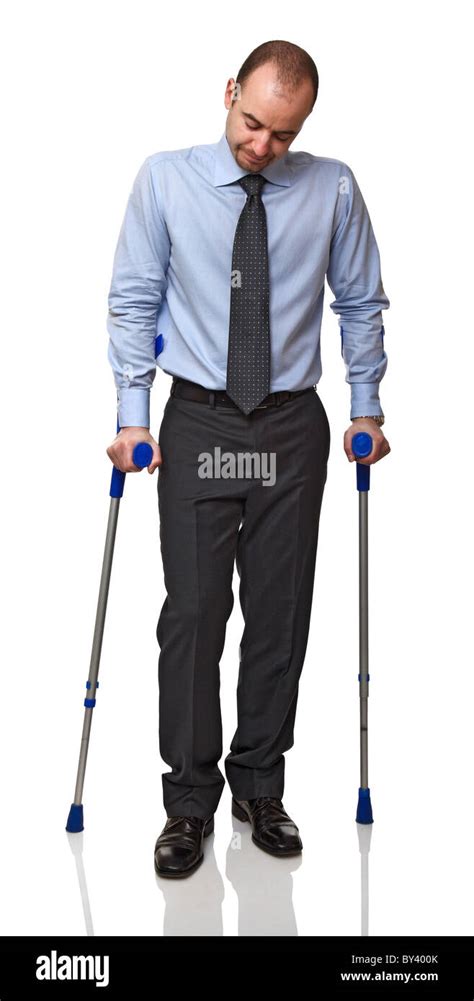 Businessman Man Walking With Crutch Isolated On White Stock Photo Alamy