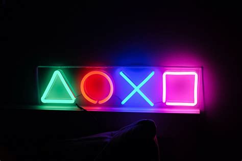 Playstation Ps5 Ps4 Game Console On Table Neon Light Lamp