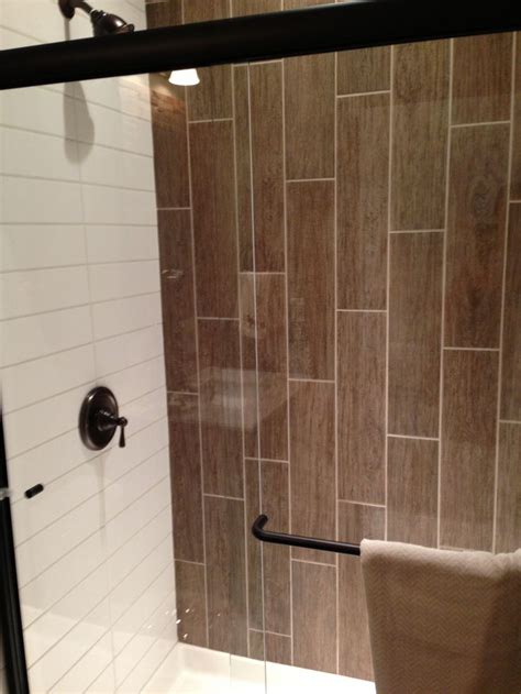 Glossy tiles are especially good for small bathrooms, as they tend to reflect a lot of light and create a sense of space that is larger than it seems. Vertical Tiles. Subway Tile. Tile Shower | Tile ...