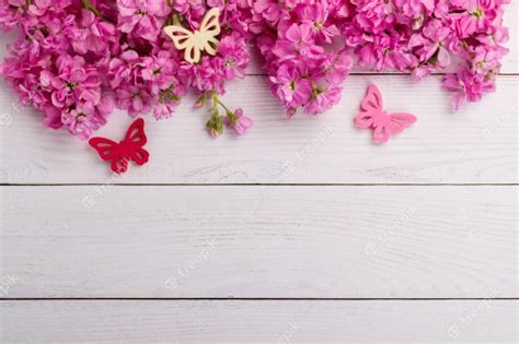 Pink Flowers On Wooden Background Premium Photo