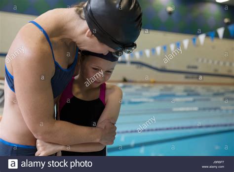 Mother And Daughter Swimmers Hugging At Swimming Pool Stock Photo Alamy