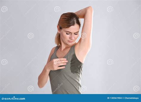 Young Woman With Sweat Stain On Her Clothes Stock Photo Image Of