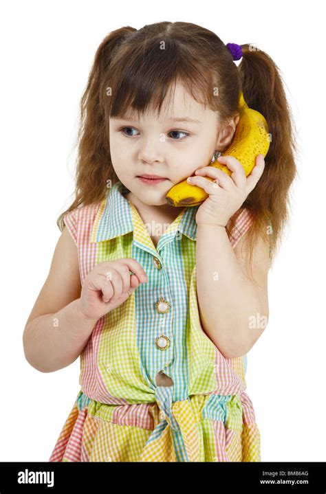 The Girl Tries To Speak By Means Of A Banana Instead Of Phone Stock Photo Alamy