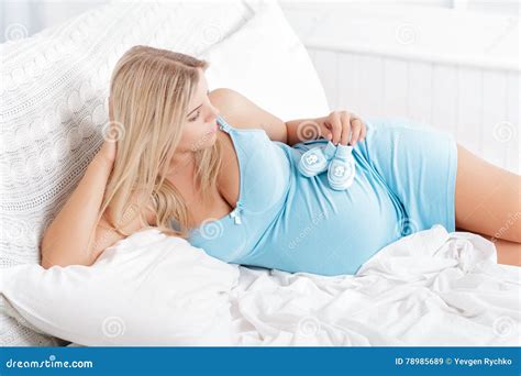 Pregnant Woman Playing With Baby Booties On Belly Stock Image Image