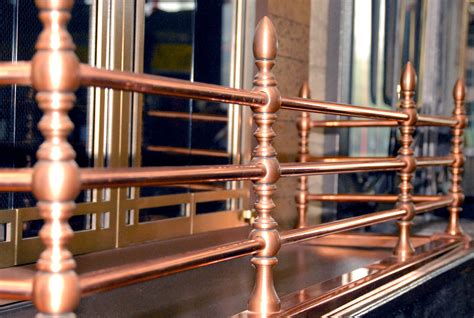 Portland Polished Copper Rail With Antique Copper Accent Grates And