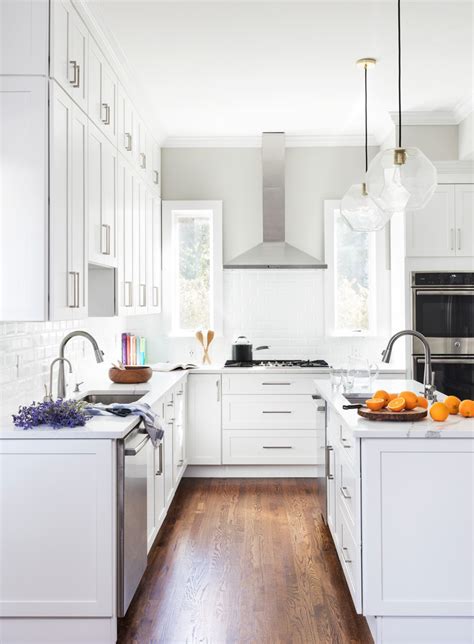 Depending on who you are, the resulting gap may not bother you at all, or it may drive you batty. High ceiling with tall cabinets - Transitional - Kitchen - New York - by Think Chic Interiors