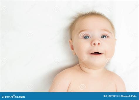 Beautiful Smiling Cute Baby Close Up Portrait Of A Happy Crawling Baby