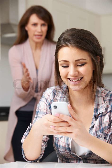 Mother Arguing With Daughter Over Use Of Mobile Phone Stock Image Colourbox