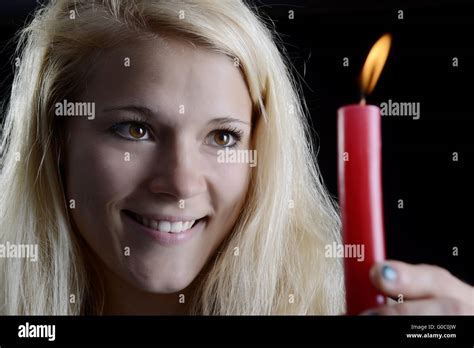 Woman With Candle Stock Photo Alamy