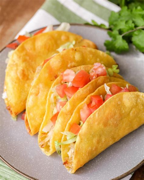 I typically use a rotisserie chicken to make life a the chicken is tossed in taco seasoning and lime juice and stuffed into taco shells. Restaurant-Style Shredded Chicken Tacos (+VIDEO) | Lil' Luna
