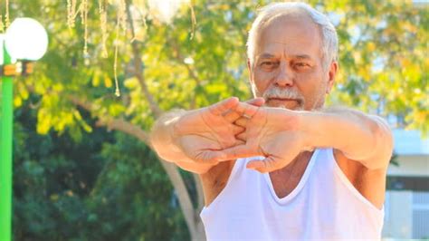 We did not find results for: Old Man Does Morning Exercises Stretches Fingers in Park ...