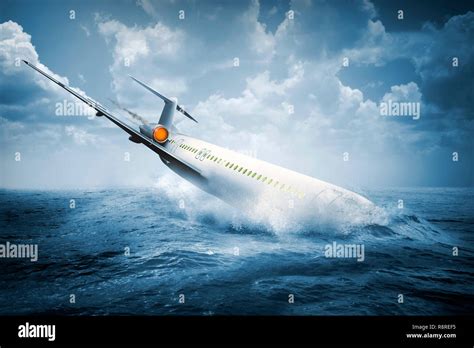 Falling Plane Accident Crashing Into The Water On The Sea Stock Photo