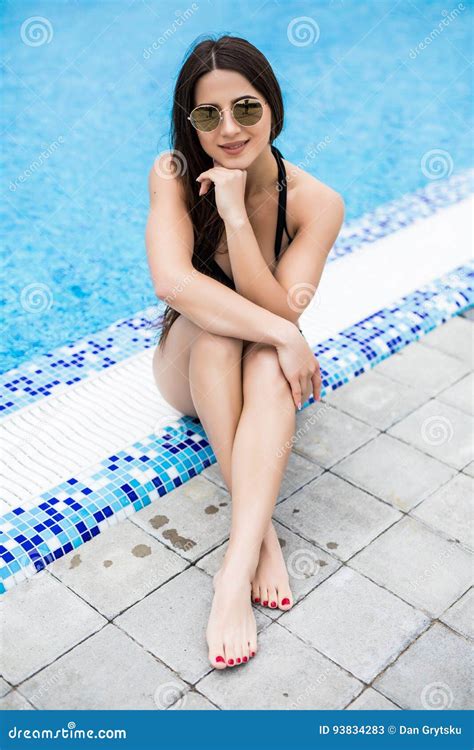 Top View Brunette Woman In Black Bikini Sitting Near The Swimming Pool My XXX Hot Girl