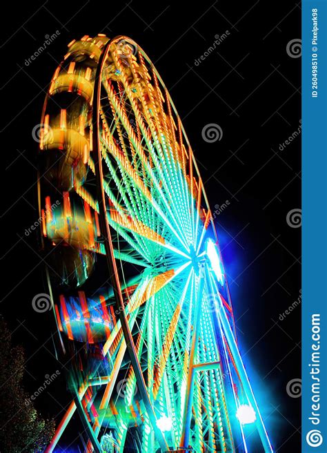 A Ferris Wheel In Motion With Long Exposure Stock Photo Image Of