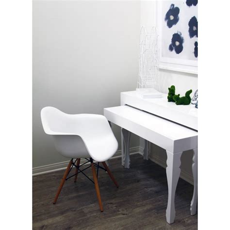 Pairs fine fabric or leather with molded wood. Eames Style DAW Molded in White Plastic Dining Armchair with Wood Eiffel Legs