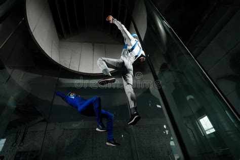 A Man And A Woman Enjoy Flying Together In A Wind Tunnel Free Fall