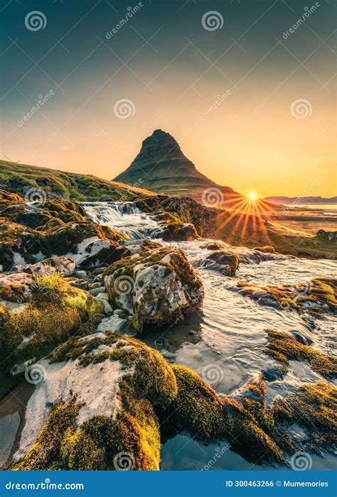 Golden Sunrise Over Kirkjufell Mountain With Waterfall Flowing In