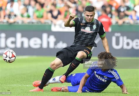 chelsea fc s nathan ake tackles werder bremen s marnon busch during a news photo getty images