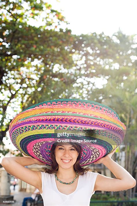 Woman Wearing Sombreros High Res Stock Photo Getty Images