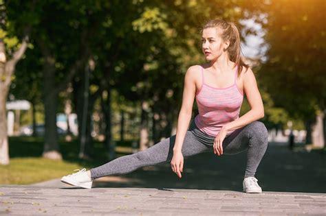 Premium Photo Fit Fitness Woman Doing Stretching Exercises Outdoors At Park