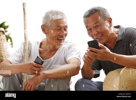 Farmers Use Mobile Phones Stock Photo Alamy