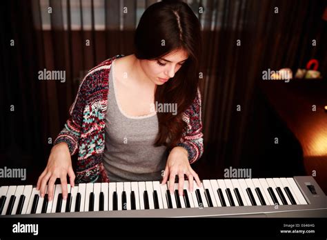 Beautiful Young Woman Playing Piano Stock Photos And Beautiful Young
