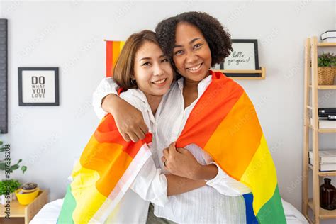 Couple Of Same Sex Marriage From Difference Races Holding Lgbtq Rainbow Flag For Pride Month To