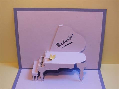 The paper between each of the cuts will form a tab that you'll secure your pop up art to. Piano Pop Up Card · How To Make A Pop Up Card · Papercraft ...