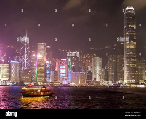 Night View Of The Ifc Building And A Cruise Ferry Victoria Harbour In