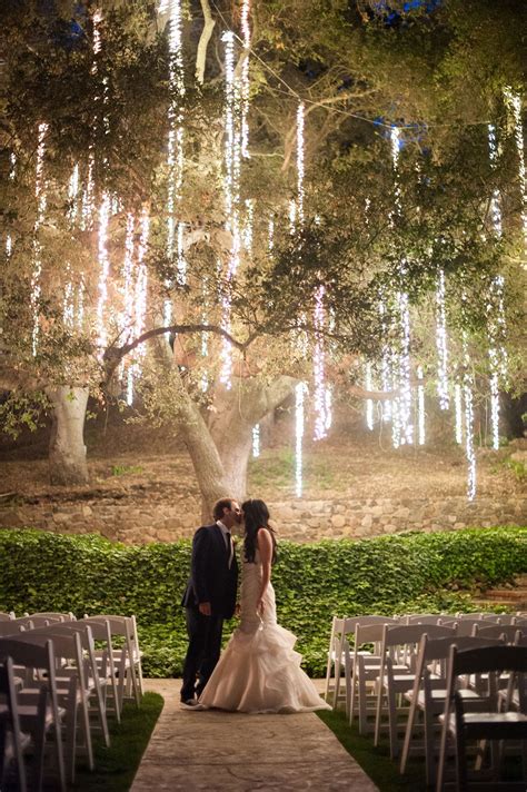 Once it starts to get dark, fairy lights offer an ethereal glow that is sure to make for a beautiful outdoor wedding. Twinkling lights dripping from the tree add a fairy tale ...