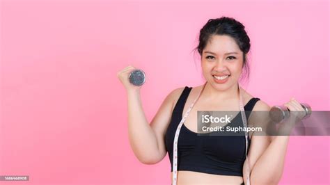 asian fat women fat girl chubby overweight plus size exercise with dumbbell lifting lifestyle