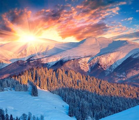Colorful Winter Sunrise In Mountains Stock Photo
