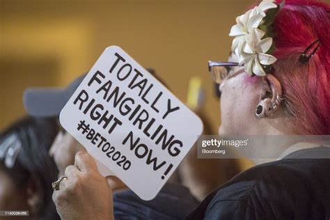 An Attendee Holds A Sign As Beto Orourke Former Representative From