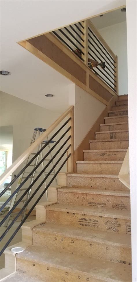 A white staircase with an iron pipe handrail starting from the fourth step. Pipe stairs | Stairs, Home decor, Decor