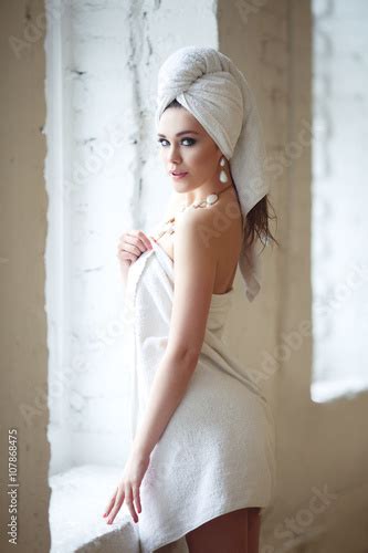 Sexy Girl With A Towel On His Head Standing Near A Window Stock Photo And Royalty Free Images