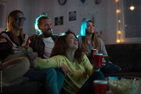 Friends Watching Movie At Home By Stocksy Contributor Jovo Jovanovic