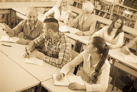 Adult Students Writing In Classroom Stock Image Image Of Smile Copy