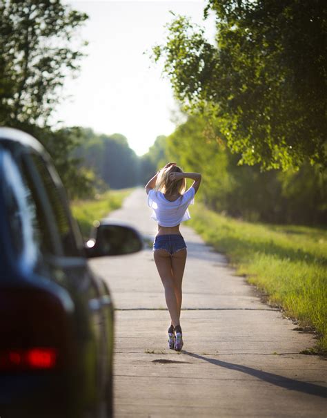 Women Model Blonde Ass Standing Legs Back Arms Up Women Outdoors Jean Shorts Road T