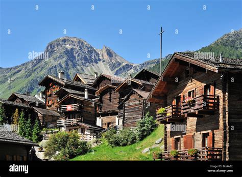 Traditional Swiss Wooden Houses Chalets In The Alpine Village