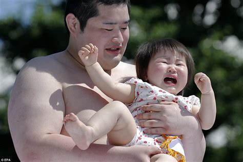 Hulking Sumo Wrestlers Try To Make Babies Cry At Japanese Festival