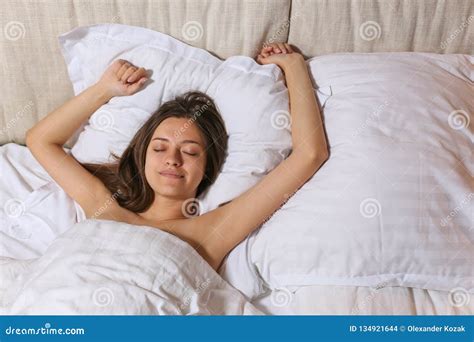 Top View Of Attractive Young Woman Sleeping Well In Bed Hugging Soft White Pillow Teenage Girl