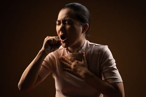Asian Woman Was Sick With Sore Throat Standing Isolated On Beige