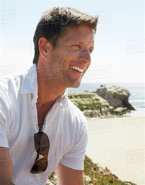 Smiling Man Enjoying Beach Stock Photo Dissolve