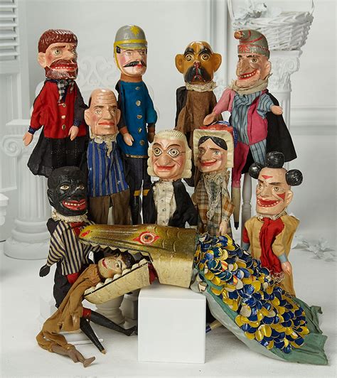 Eleven Early Carved Wooden Characters From Punch And Judy Puppet
