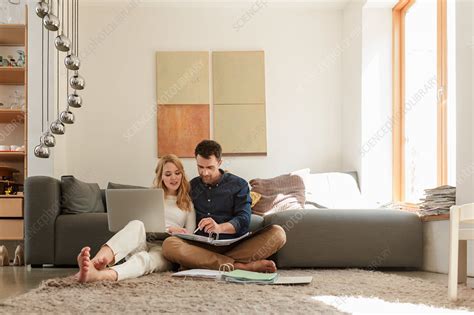 Couple With Laptop Looking At Paperwork Stock Image F0178610