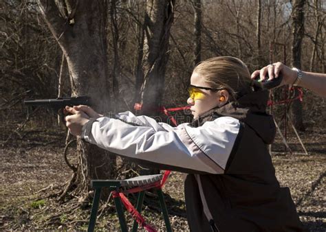 Teen Girl Shooting Pistol With Coach S Hand Timing Stock Photo Image