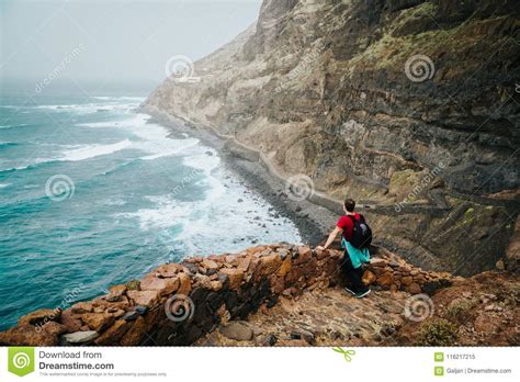 Men Hiker With Backpack On The Scenic Coastal Road The Route Leads