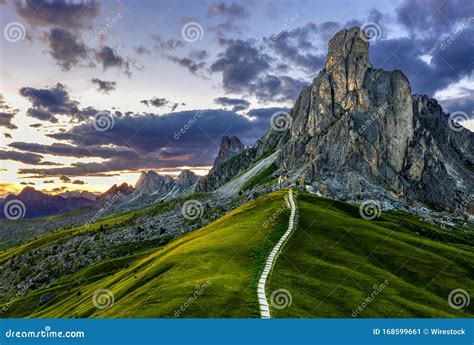 A Pathway Leading Into The Mountain At Passo De Giau At The Dolomites